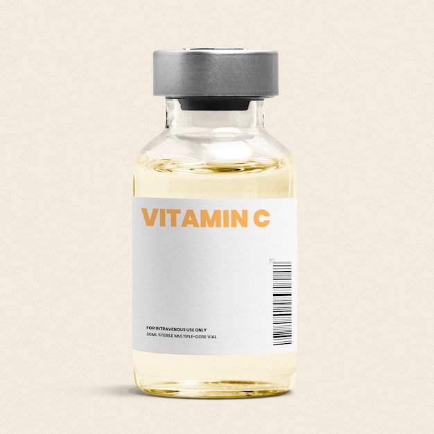 Vitamin c injection in a glass bottle vial with yellow liquid Free Photo