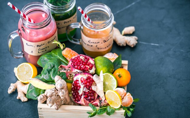 vitamin fresh fruit smoothies in glass jars with fruit