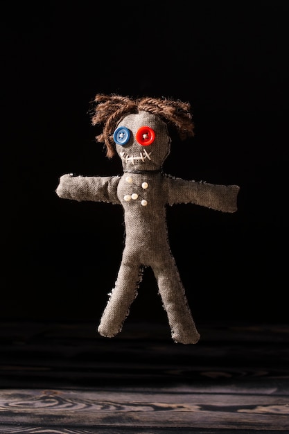 Vodoo doll and dark background