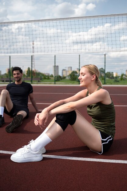 Volleyball players resting after match