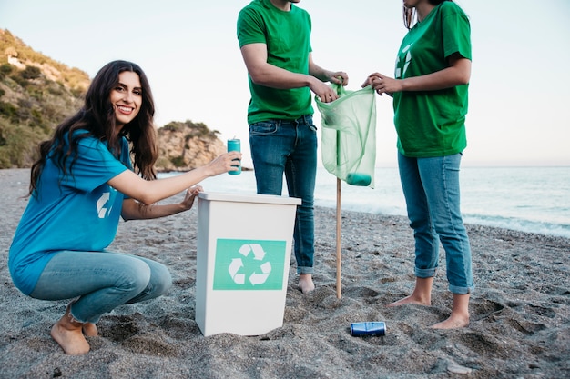 Volunteer and beach concept with smiling woman