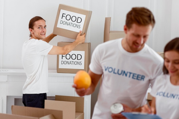 Volunteers helping with food donations for charity day