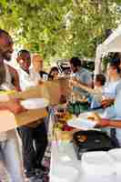 Free photo volunteers provide meal boxes and canned goods to needy individuals seniors and homeless people receive nourishment from smiling workers embodying spirit of food drive and nonprofit organization