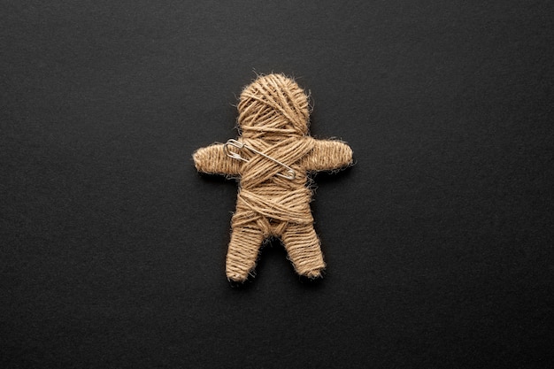 Free photo voodoo doll on dark background