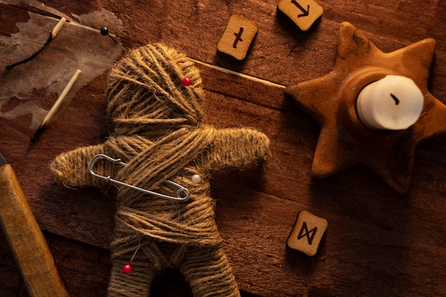 Free photo voodoo doll and esoteric elements top view