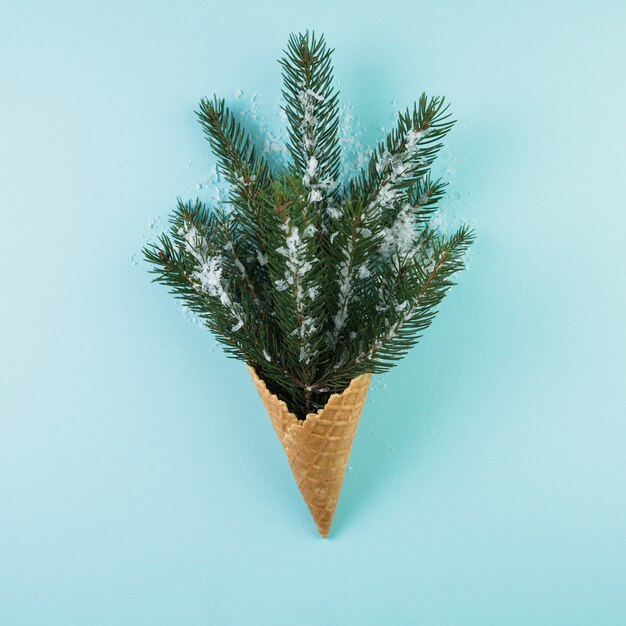Wafer cup with fir twig and ornament snow 