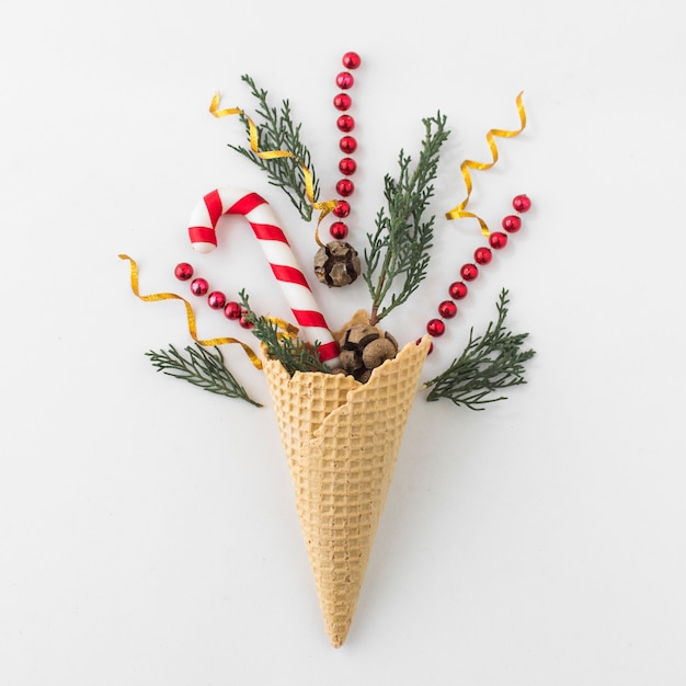 Waffle cone with branches and candy cane
