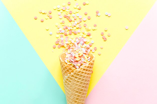 Waffle cone with colorful sugar sprinkles 