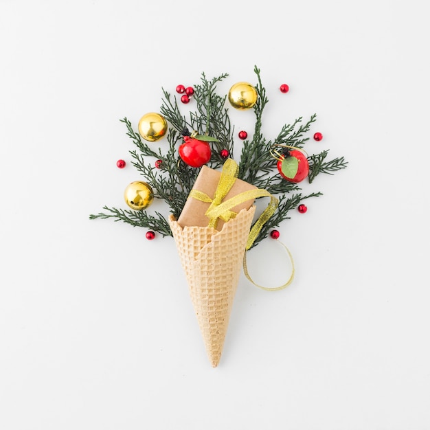 Waffle cone with present box and decorated coniferous twig