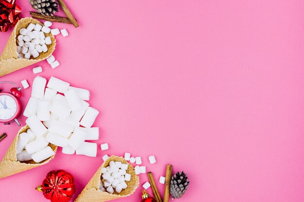 Waffle cones with Christmas toys on table 