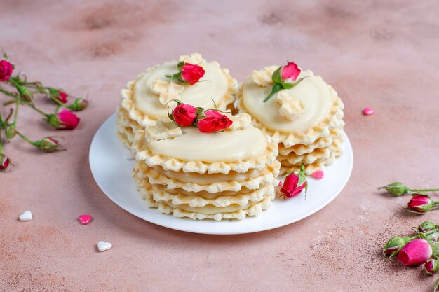 Waffle cookies with homemade delicious cream.