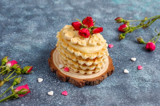 Waffle cookies with homemade delicious cream.