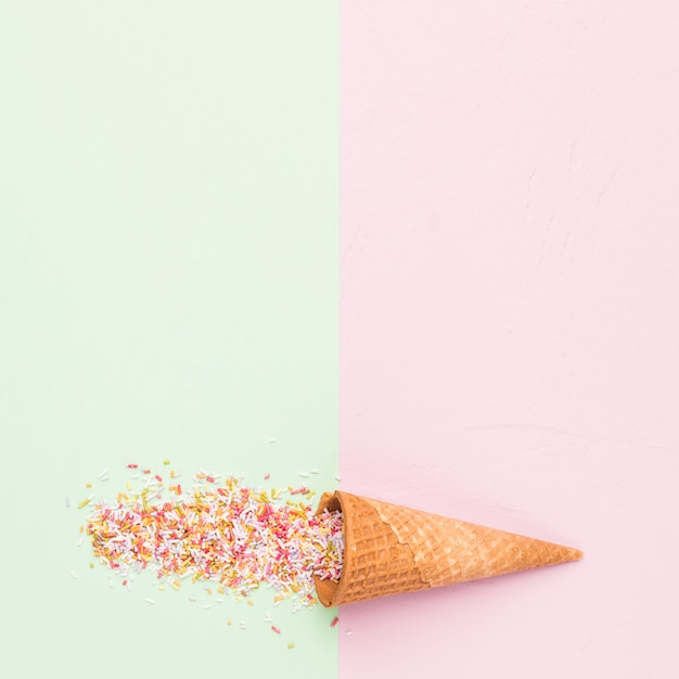 Free photo waffle style sugar cone and rainbow sprinkles