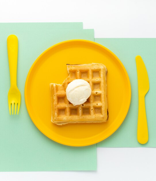 Waffle on yellow childish plate