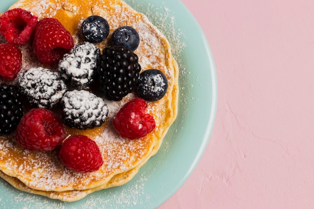 Waffles and wild berries close-up