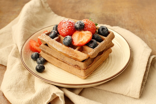 Free photo waffles with raspberry and blueberry