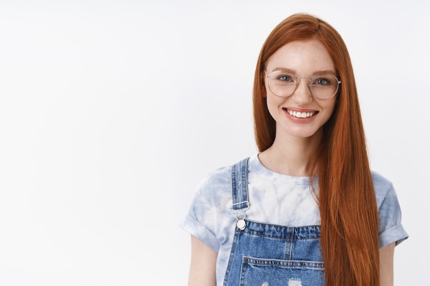 Waist-up confident good-looking casual redhead girl blue eyes long red natural hairstyle, express happiness determined receive first prize, lucky upbeat mood, stand white wall self-assured