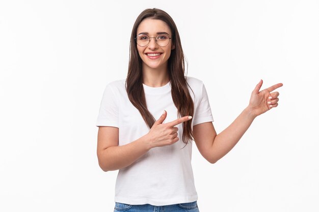 Waist-up portrait of enthusiastic, pleasant brunette woman in glasses