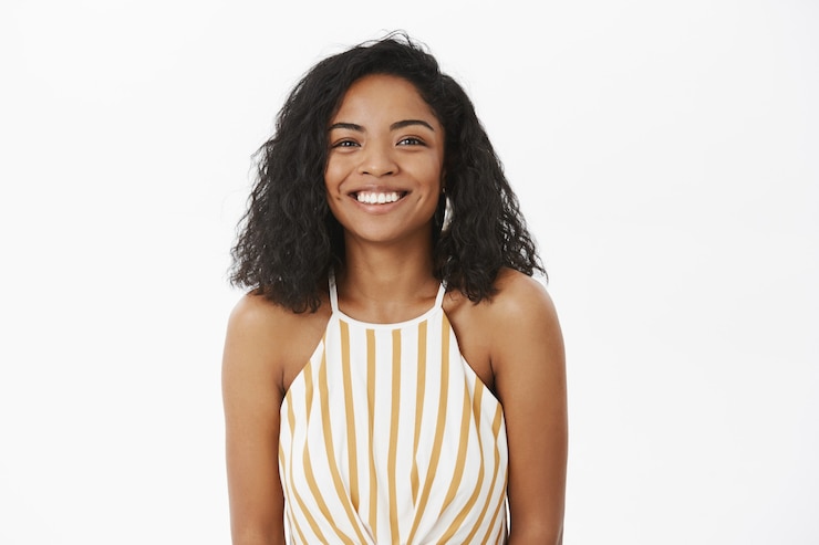 Free Photo waist-up shot of friendly-looking charming and timid african american girlfriend with curly hairstyle