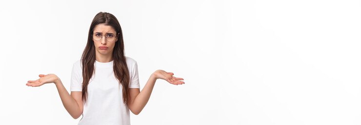 Free Photo waistup portrait of indecisive distressed gloomy young woman in glasses cant deal with proble shrugg