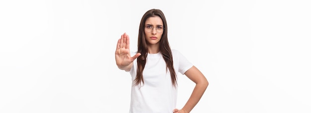 Waistup portrait of seriouslooking displeased confident young woman in glasses activist or humanrigh