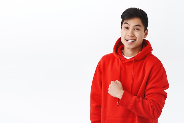 Waistup portrait upbeat enthusiastic young man cheering up team fist pump encourage people liveup smile and be happy standing optimistic white background champion attitude