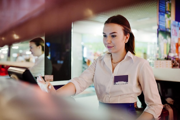 Waiter girl working with pos terminal or cashbox at cafe People and service concept