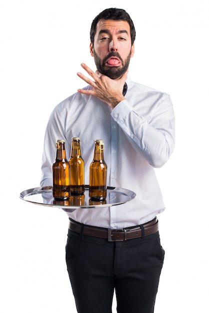 Free photo waiter with beer bottles on the tray drowning himself