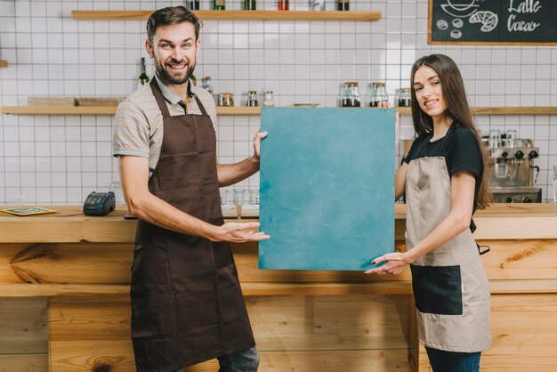 Waiters presenting chalkboard