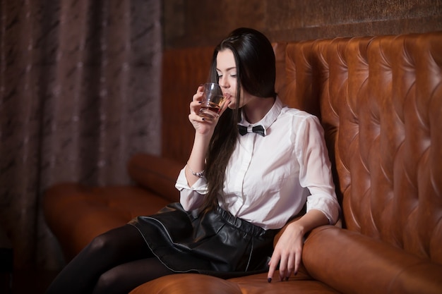 Waitress driking a glass