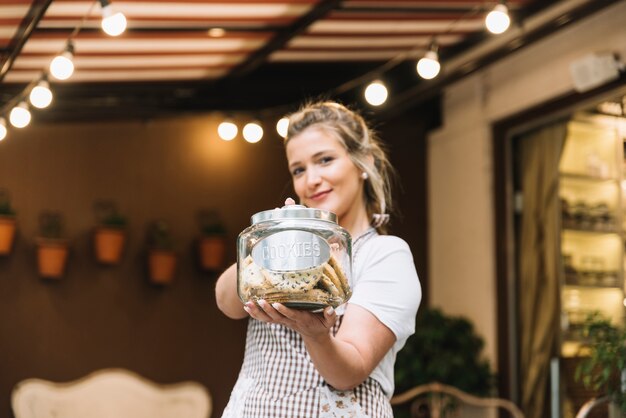 Waitress offering cookies 