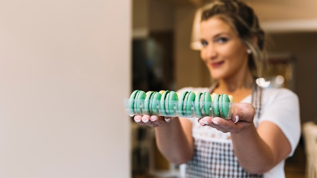 Waitress offering macarons 