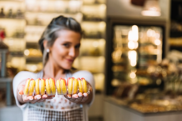 Waitress offering macarons 