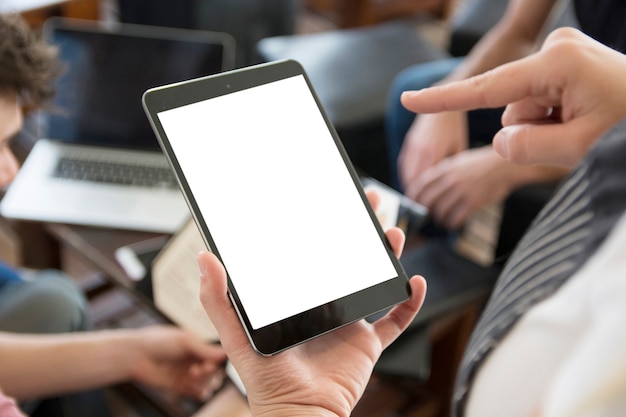 Free photo waitress pointing finger at blank digital tablet