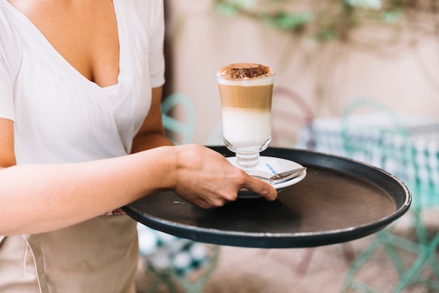 Waitress serving coffee