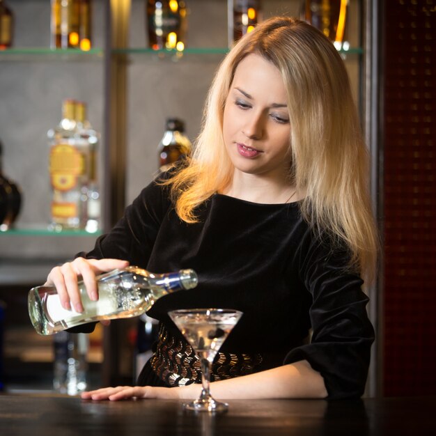 Waitress serving a drink