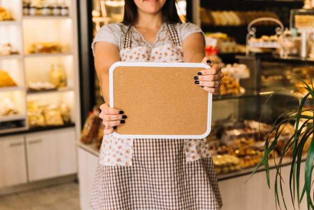 Free photo waitress showing board