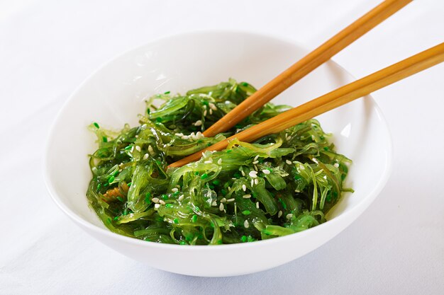 Wakame Chuka or seaweed salad with sesame seeds in bowl