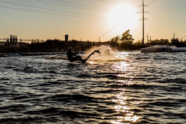 wakeboard. wakeboarding jumping at sunset