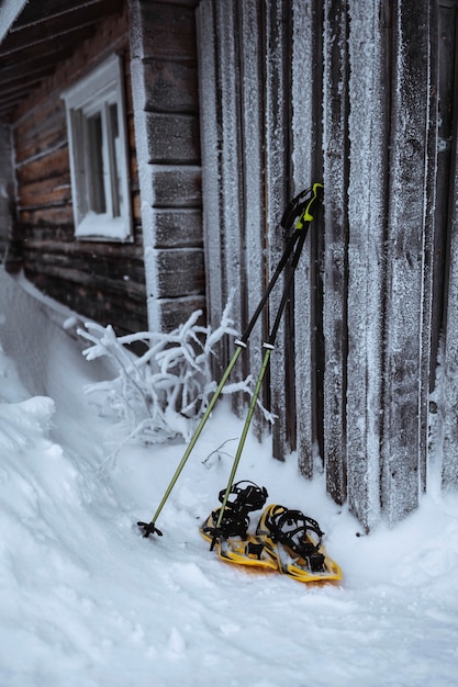 Free photo walking stick and snowshoes by ajds wooden wall