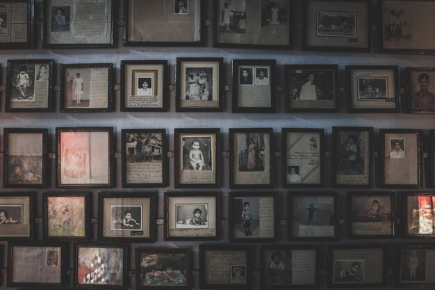 Wall full off old photos in photo frames