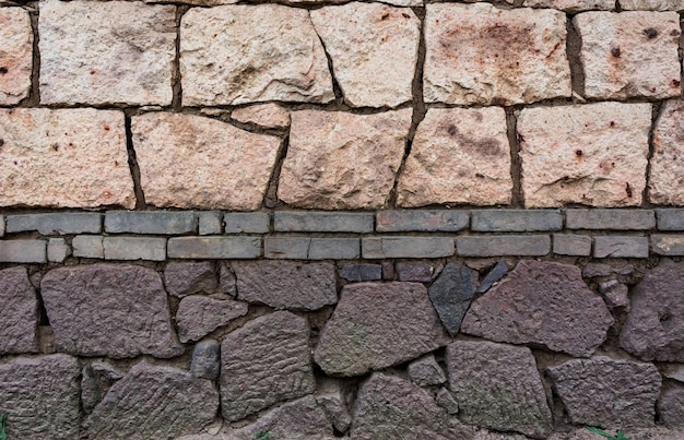 Wall made of bricks and stones