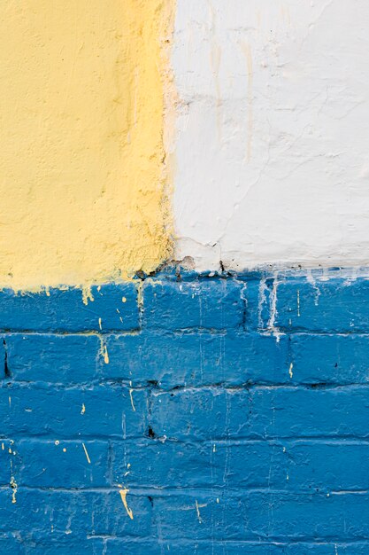 Wall with painted bricks and concrete