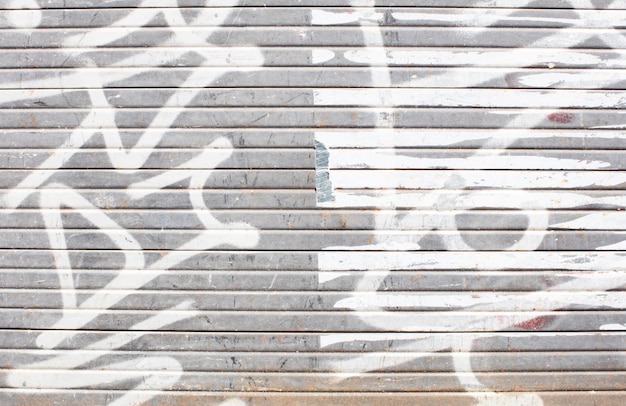 Wall with white graffiti