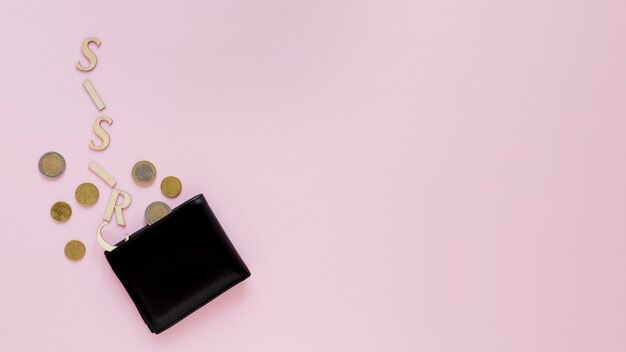 Wallet with coins on table