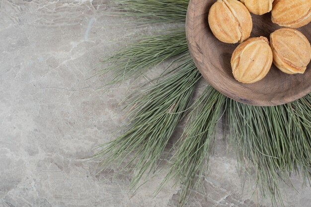 Walnut shaped cookies in wooden bowl. High quality photo