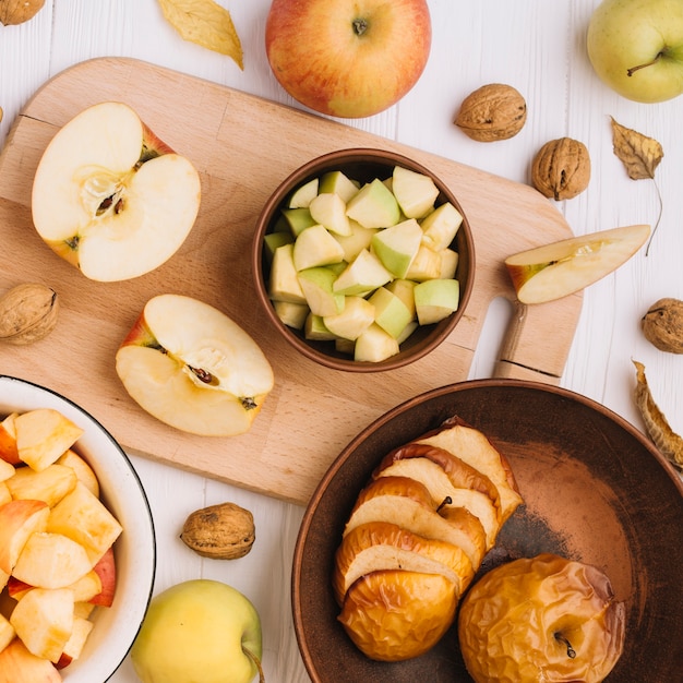 Walnuts and leaves near apples