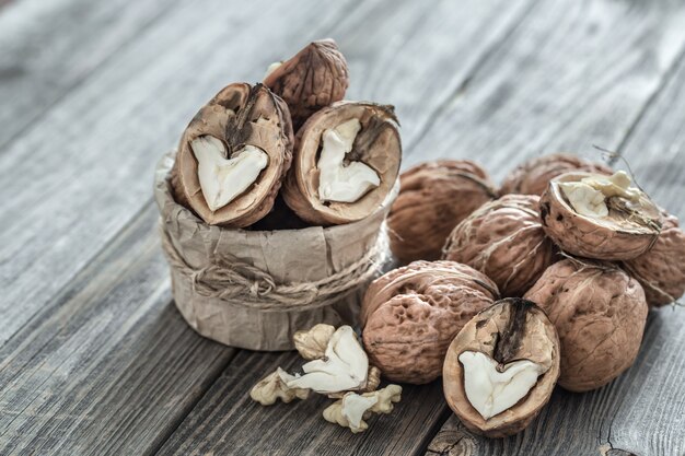 Walnuts and sack on wooden table