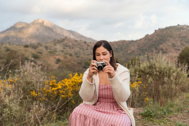 Free photo wanderlust nature with beautiful female traveler