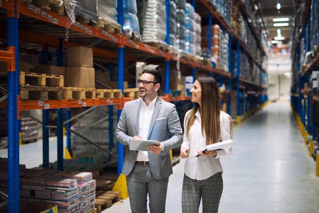 Warehouse workers talking about logistics and distribution